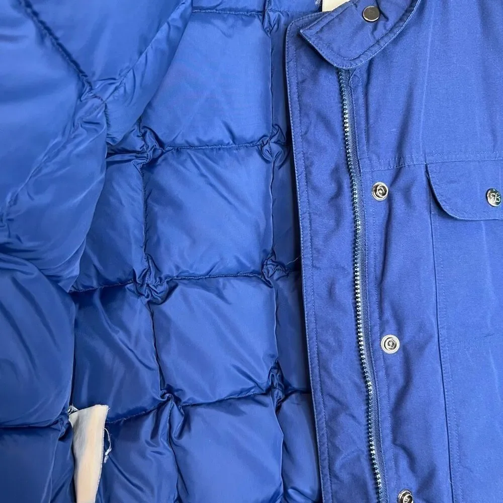 This is a vintage Eddie Bauer women's goose down-filled vest in blue 80’s strang